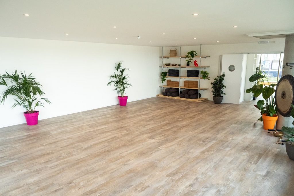 Bright and spacious yoga studio rental in London with wooden floors and natural light, perfect for classes and wellness sessions.